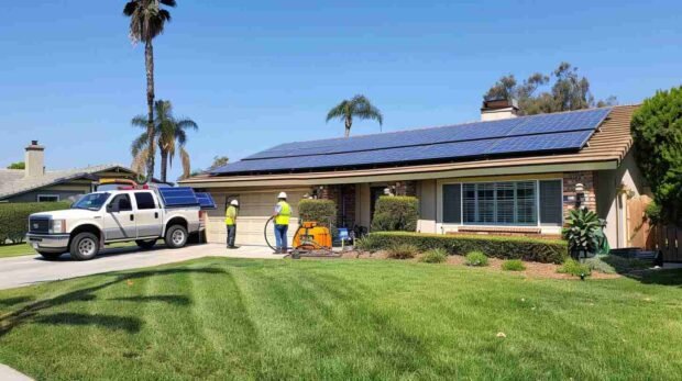 employees finishing in up a solar installation in Chula Vista